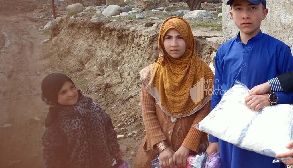 Afghan Children Receiving Winter Clothes by HBT